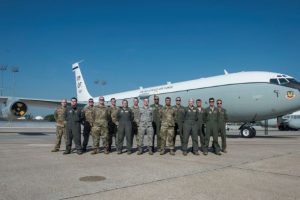 The award winning glass titan team poses for a photo in front of a WC-135W Constant Phoenix on the flightline June 16.